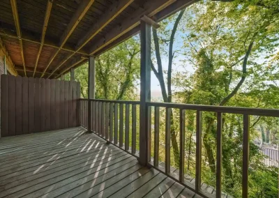 Large deck with beautiful view off the kitchen of the Dogwood Garden floorplan at Hillwood Villas apartments, Knoxville, TN.